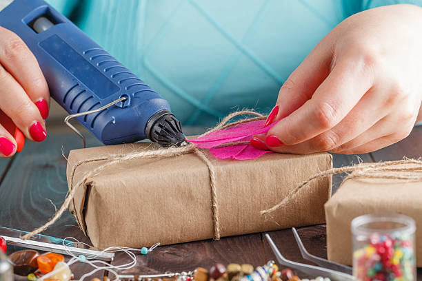 istock Woman glue gift box 506327468
