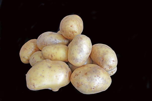 Potato Pileup Some Victoria potatoes. pileup stock pictures, royalty-free photos & images