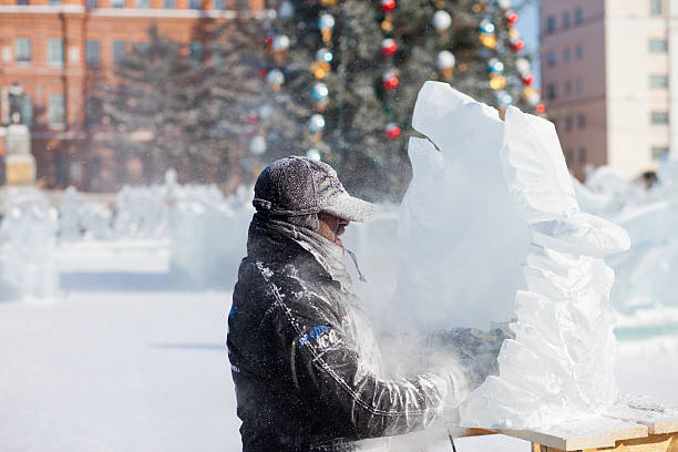 chabarowsk, russland - 23. januar 2016: ice sculpture wettbewerb - ice carving sculpture chisel stock-fotos und bilder