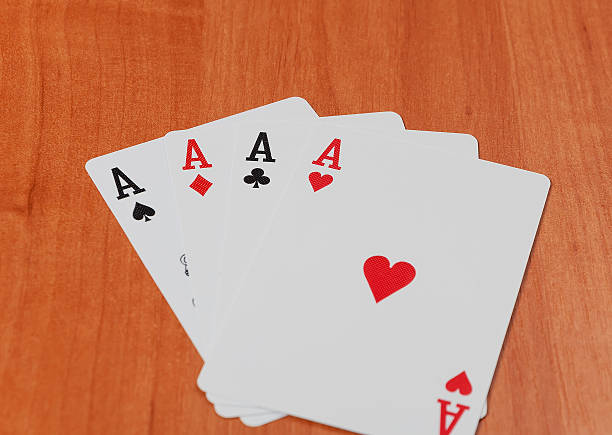 istock Old playing cards on wooden background 506328934