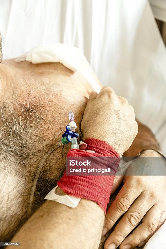 Patient with IV drip Patient recovering after surgery Accidents and Disasters Stock Photo