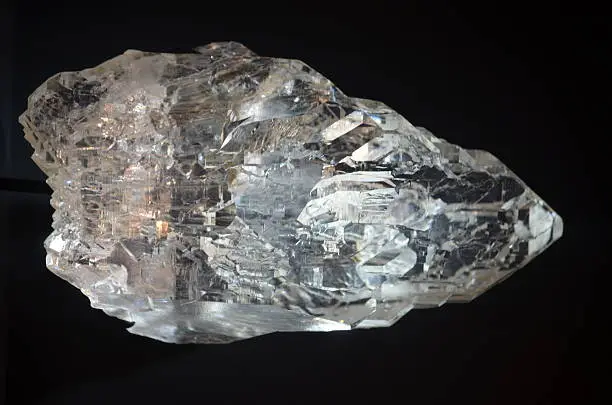 Macro of a rough white topaz crystal.
