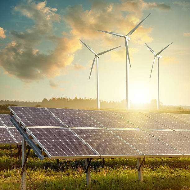istock solar panels and wind generators against on sunset 506329809