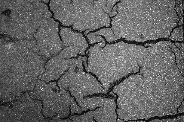This is a piece of cracked and crumbled roadway. Shoot in Italy by sunlight