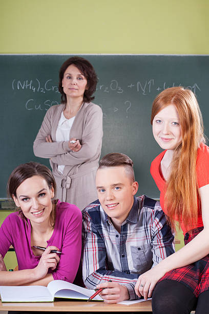 istock Teacher and students during chemistry lesson 506330413