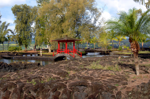 liliuokalani Gardens in Hilo, Hawaii is the largest Edo Style Garden outside of Japan.   Attractive red pagoda pavillian connects several pools inside garden.