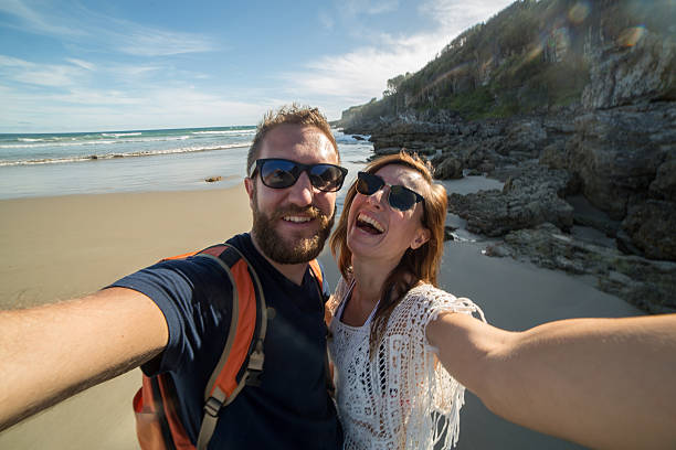 istock Young adults taking selfie portrait on the beach-Summer 506339664