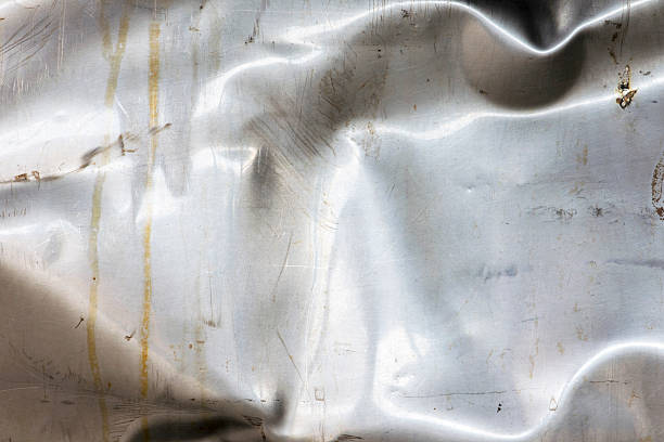 istock Old crumpled and scratched metal texture 506339882