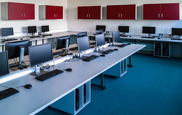 PC Room Room with computers in a row. computer lab stock pictures, royalty-free photos & images