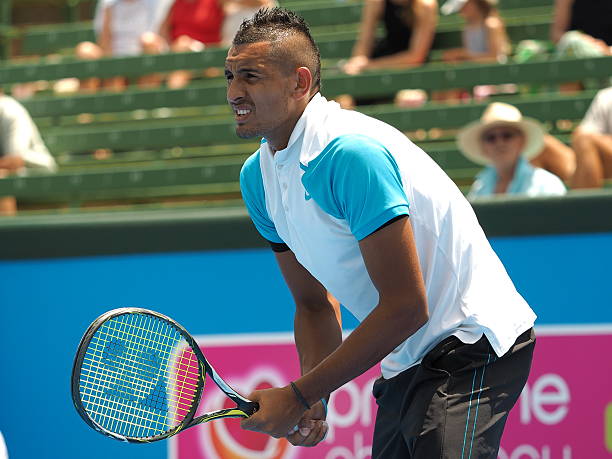 Nick Kyrgios at an Exhibition match at Kooyong Tennis Club Melbourne, Australia - January 13, 2016: Nick Kyrgios of Australia at an Exhibition and practice match at Kooyong Tennis Club baseline stock pictures, royalty-free photos & images