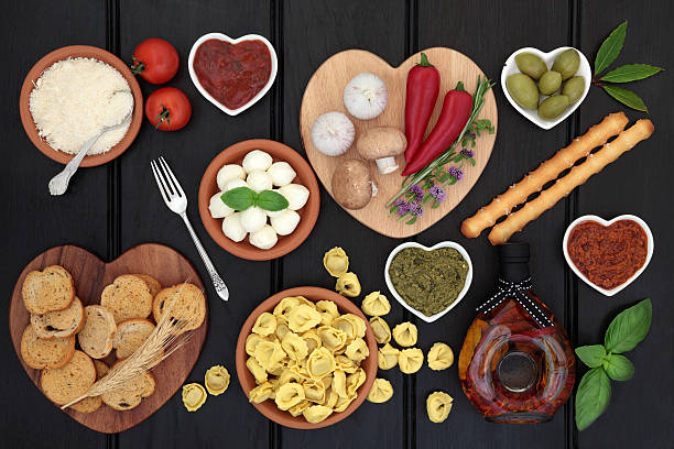 Healthy Mediteranean Diet Food Mediterranean healthy diet food selection over dark wood background. heart shaped pepper stock pictures, royalty-free photos & images