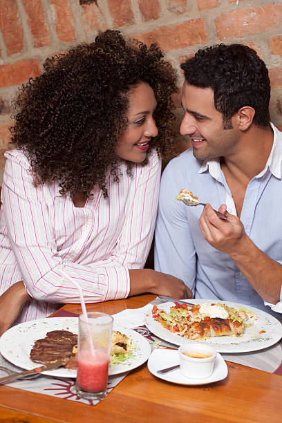 istock Happy couple at dinner in the restaurant 506343598