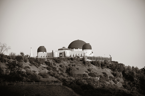 Griffith Observatory over mountain in BW in Los Angeles.