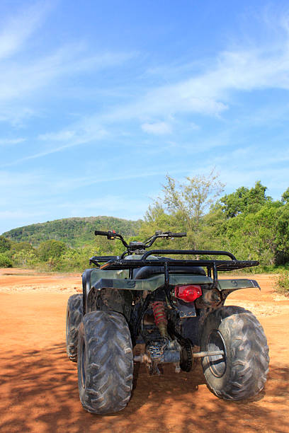 istock ATV stands on the ground in rubber tree field 506343664