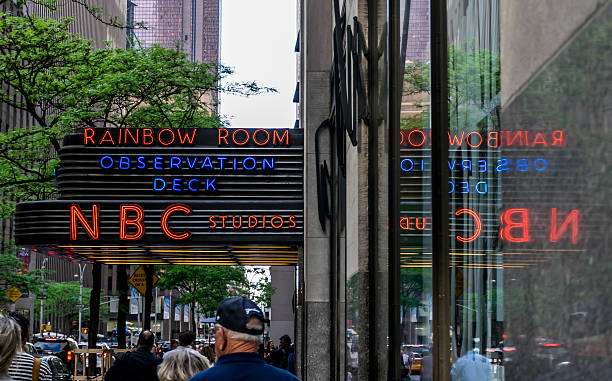 New York City, NY USA - May 12, 2015: People pass the entrance of NBC Studios in New York City, home of Saturday Night Live, NBC Nightly News, Late Night with Jimmy Fallon and more.