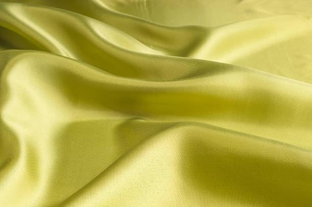 istock Silk fabric texture, background, green monochrome 506349990