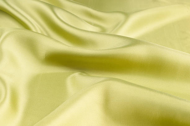 istock Silk fabric texture, background, green monochrome 506350030