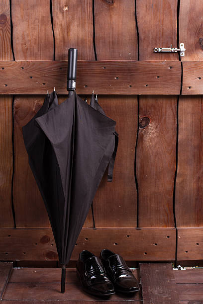 istock Black male umbrella and classic shoes. 506351800