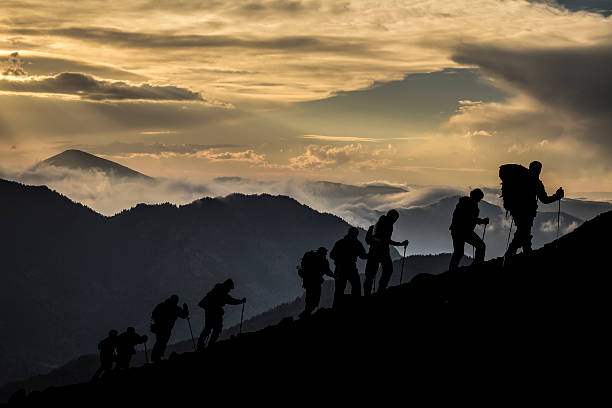 istock Silhouette of Hikers At Dusk 506353936