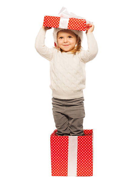 istock Happy girl pretend to be a Christmas present 506355672