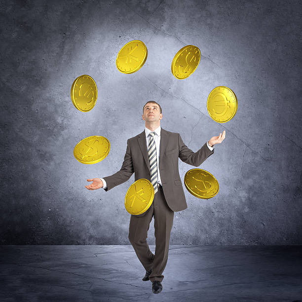 Making choice: hand throwing up a coin, isolated on white background with clipping path.