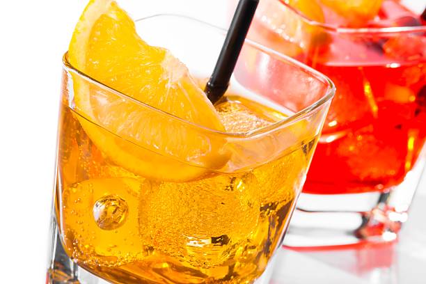 istock cocktail with orange slice on top isolated on white background 506355766