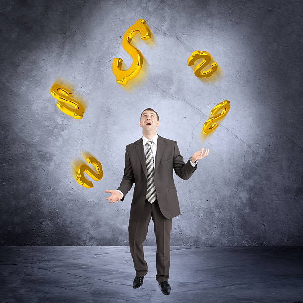 istock Businessman juggling dollar sign 506355862