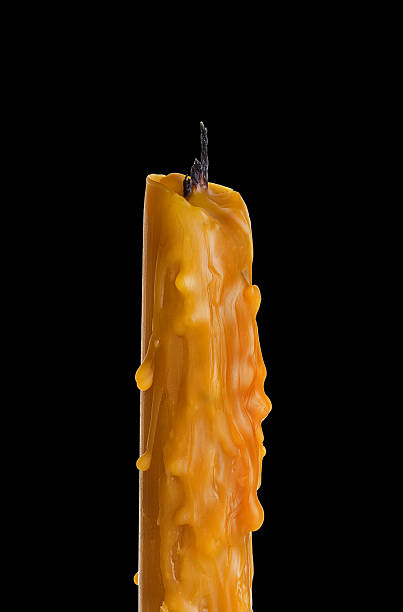 istock candle close-up on a black background 506362643