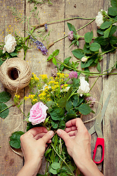 istock Florist at work. Woman making summer floral decorations 506362991