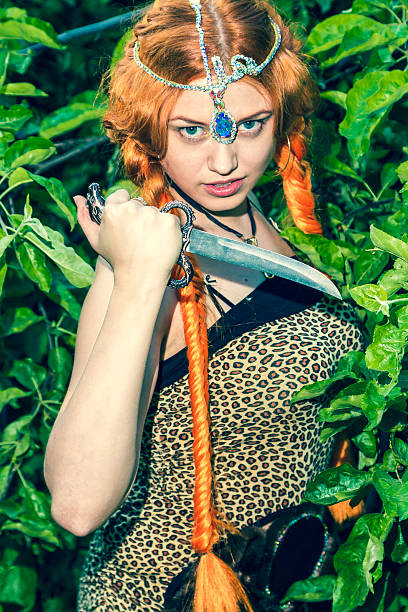 istock Beautiful woman with a knife in his hand 506363149