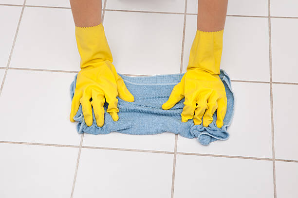 istock Young Maid Cleaning Floor 506364199