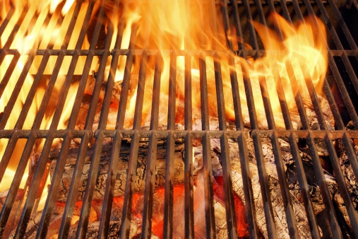 Hot BBQ Grill and Glowin Coals. Background and Texture with space for text or image.