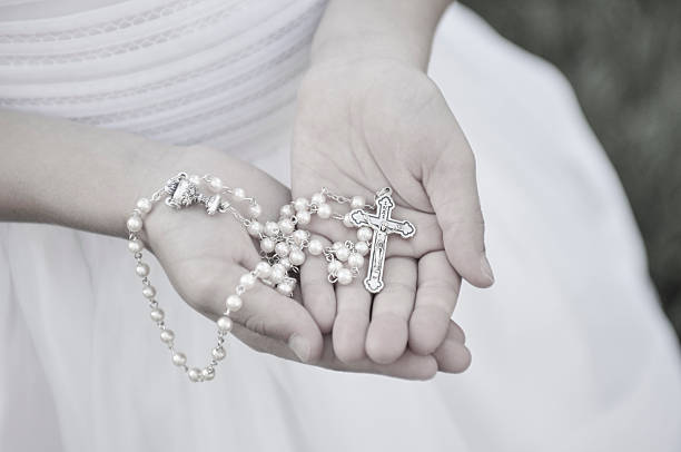 istock Rosary in Girl's hands 506365927