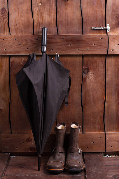 istock Vintage men's boots and umbrella. 506387654
