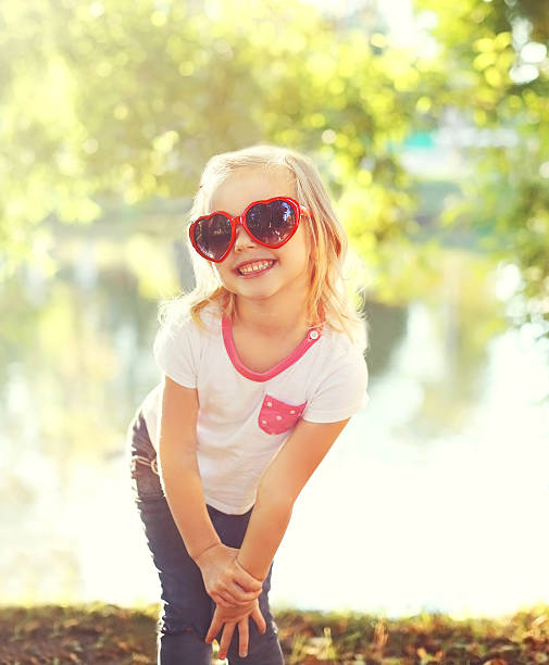 istock Happy smiling child wearing a sunglasses having fun in summer 506388498