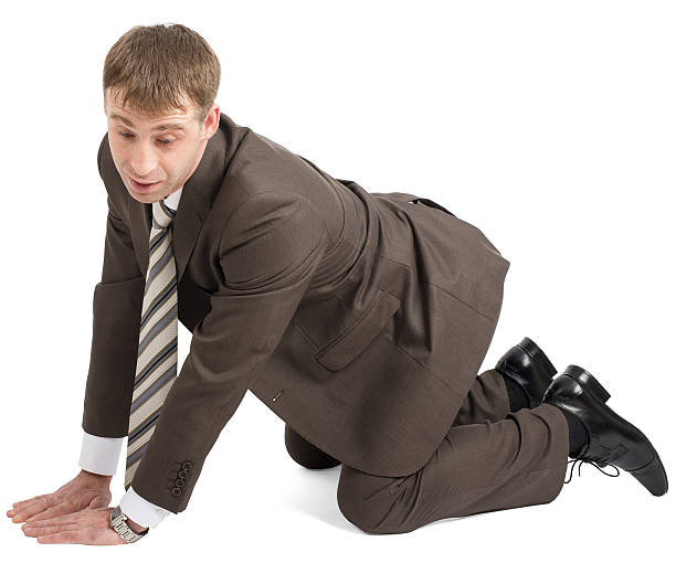 istock Businessman on knees and arms 506390514