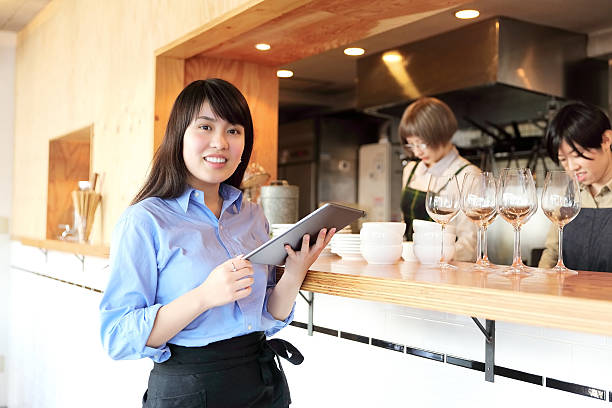 istock Young female manager with a handheld terminal 506390530