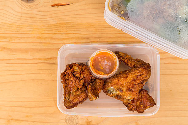 istock Convenient but unhealthy disposable plastic lunch boxes with meal 506390556
