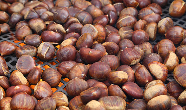 istock chestnuts roasted on the fire from a street vendor 506391074