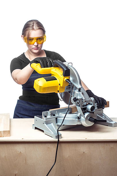 istock woman with a circular disk saw 506391792