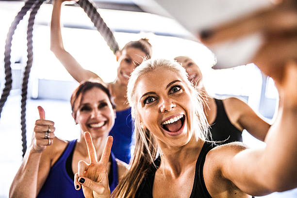 istock Fitness friends having a break with selfie post workout 506391928