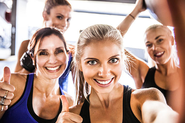 istock Fitness friends having a break with selfie post workout 506393306