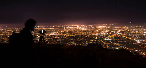 Photographer, photographing Murcia at night.Spain.