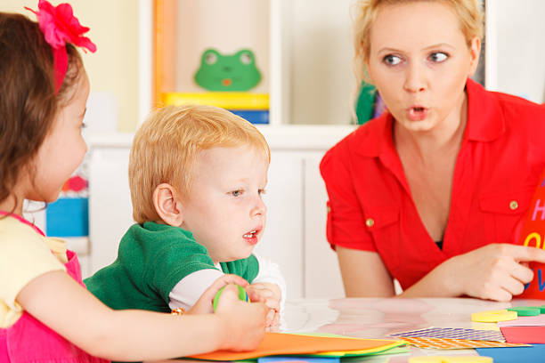 istock Pre-school children in the classroom with the teacher 506396537
