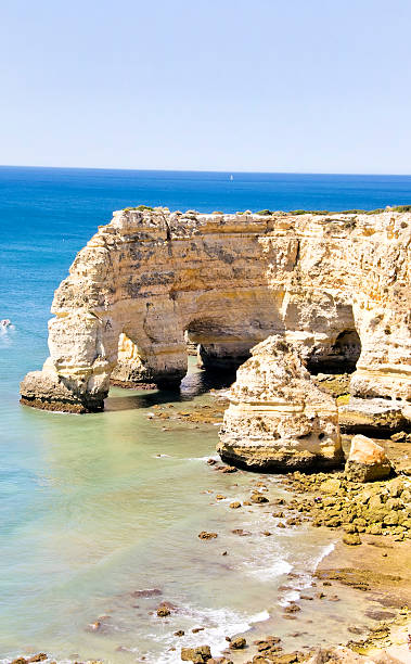 istock Rock cliff arches on Marinha beach ,Portugal 506398136