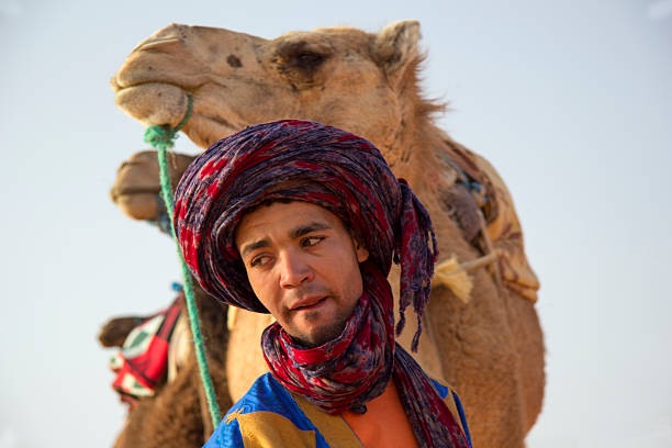 Bedouin and camels stock photo