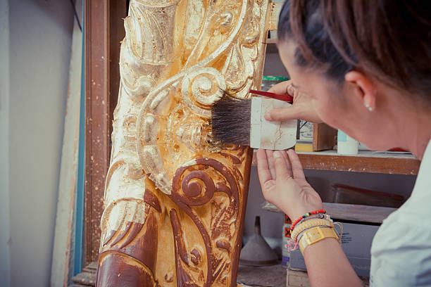istock Women working on Antique Gold Picture Frame 506398861