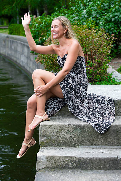 istock woman by the river 506399437