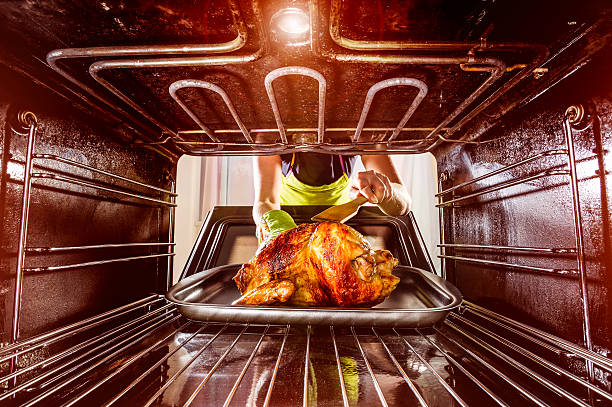 istock Cooking chicken in the oven at home. 506399667