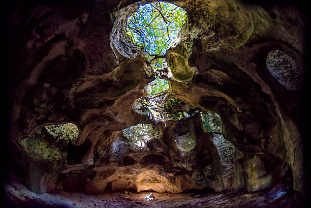 Natural Cave Natural Cave on the beach in the caribbean. grand cayman stock pictures, royalty-free photos & images